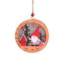 Round wooden New Christmas Tree Pendant with Santa in a red hat, holding gifts near a red house and pine trees under a starry sky.