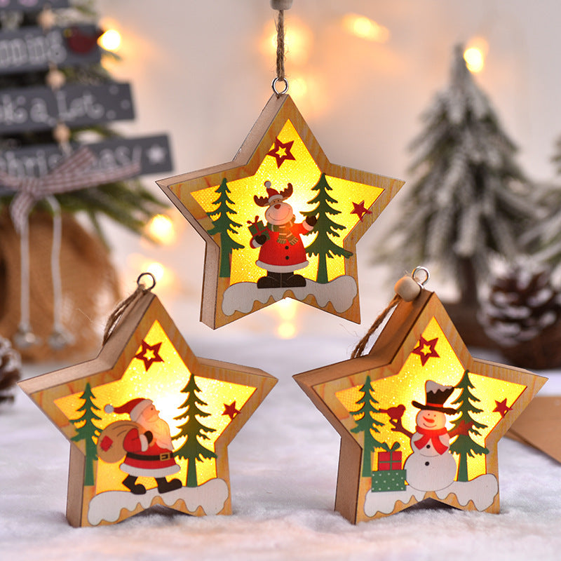 Star-shaped New Christmas Tree Pendant ornaments with LED lights, showcasing Santa, snowman, and reindeer characters in a snowy forest scene.